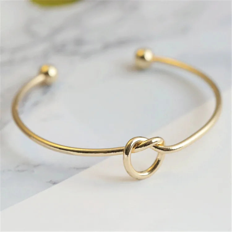 Golden Bracelet with Knot Detail