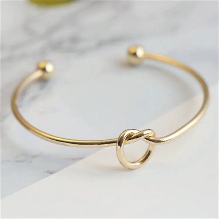 Golden Bracelet with Knot Detail